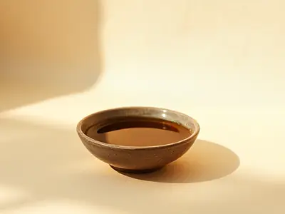 Ceramic dish filled with thick golden amber balm