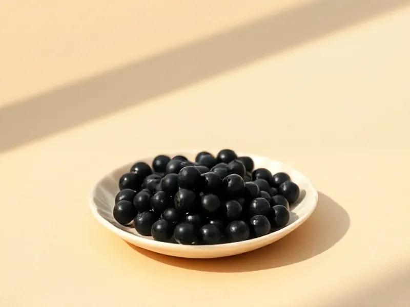 Black caviar pearls in a small dish