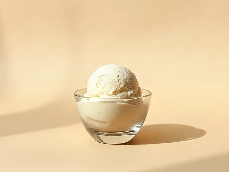 Scoop of vanilla ice cream in a dish