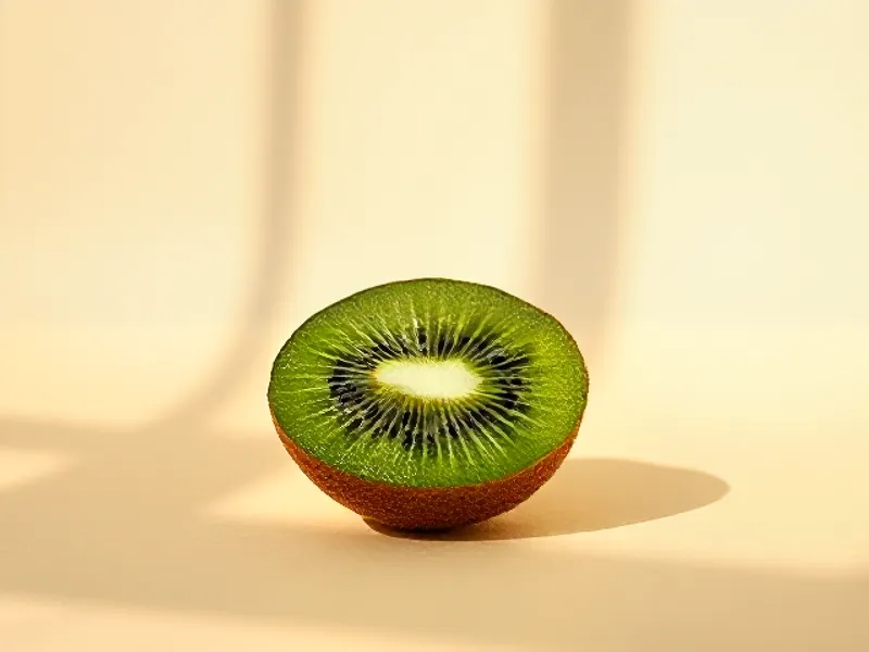 Kiwi cut open showing green flesh
