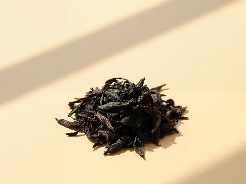 Dark, twisted black tea leaves